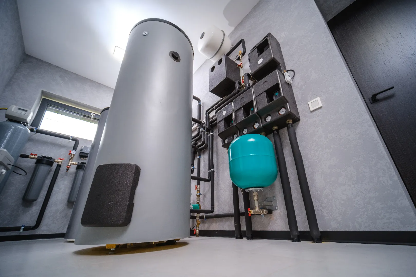 Water Heater Repair & Replacement — Modern Boiler Installation Toronto Modern electric boiler room in Toronto home after professional water heater repair and installation