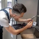 Emergency Plumber Fixing Your Kitchen Leaky Faucet Emergency Plumber Fixing Your Kitchen Leaky Faucet